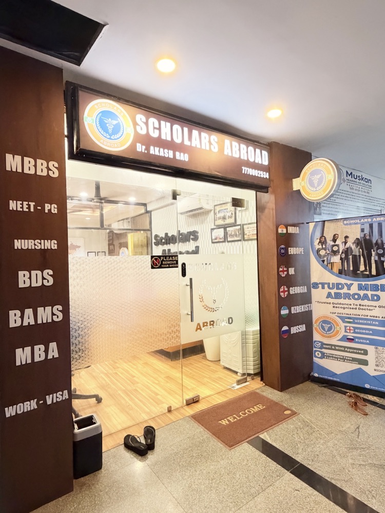 Entrance to the Scholars Abroad office in Raipur with its sign and glass door