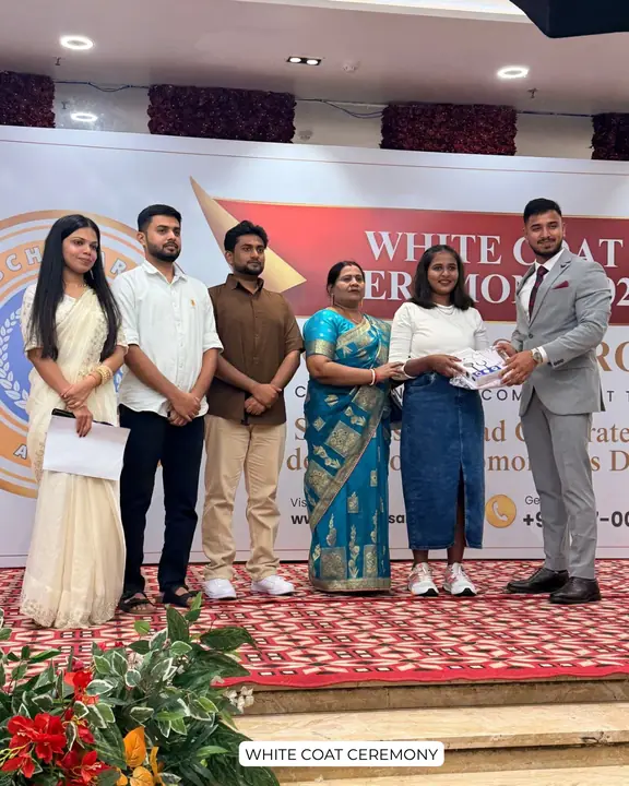 A student receiving a ceremony gift with family and Scholars Abroad representatives