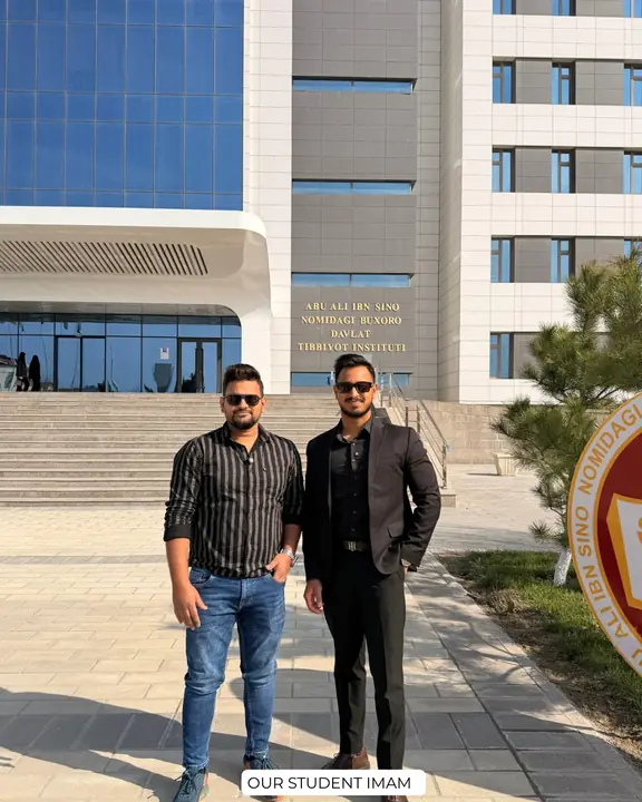Imam with a Scholars Abroad representative outside the campus building