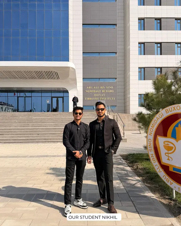 Nikhil with a Scholars Abroad representative outside the campus building