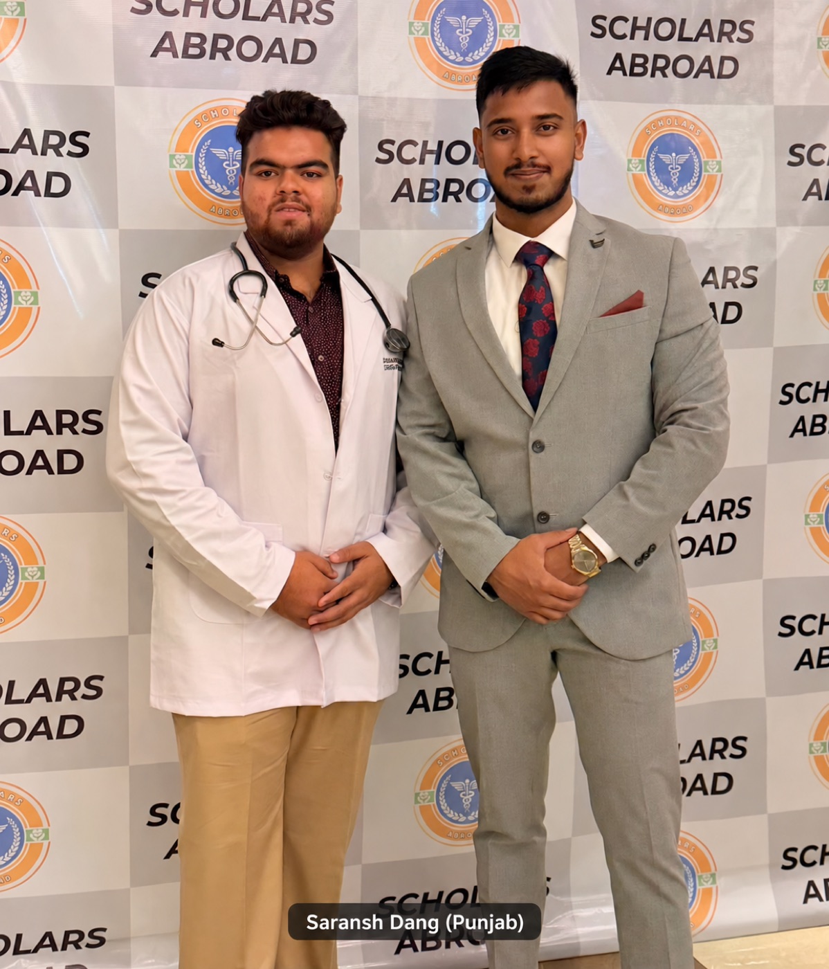 Saransh Dang in a white coat with Dr. Akash Rao at a Scholars Abroad student event.