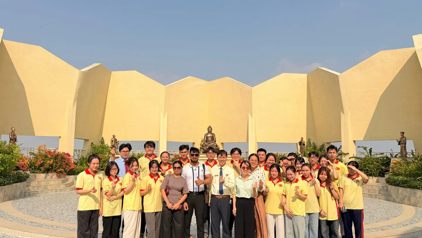 Scholars Abroad representatives with a group wearing Nam Can Tho University shirts during the visit
